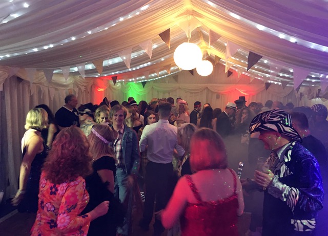 Party Guests Dancing in tent to Live Entertainment Directive
